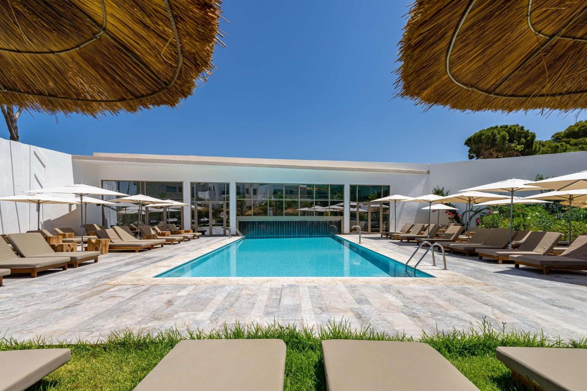 Radisson Blu Resort Al Hoceima Bagian luar foto The pool at the hotel